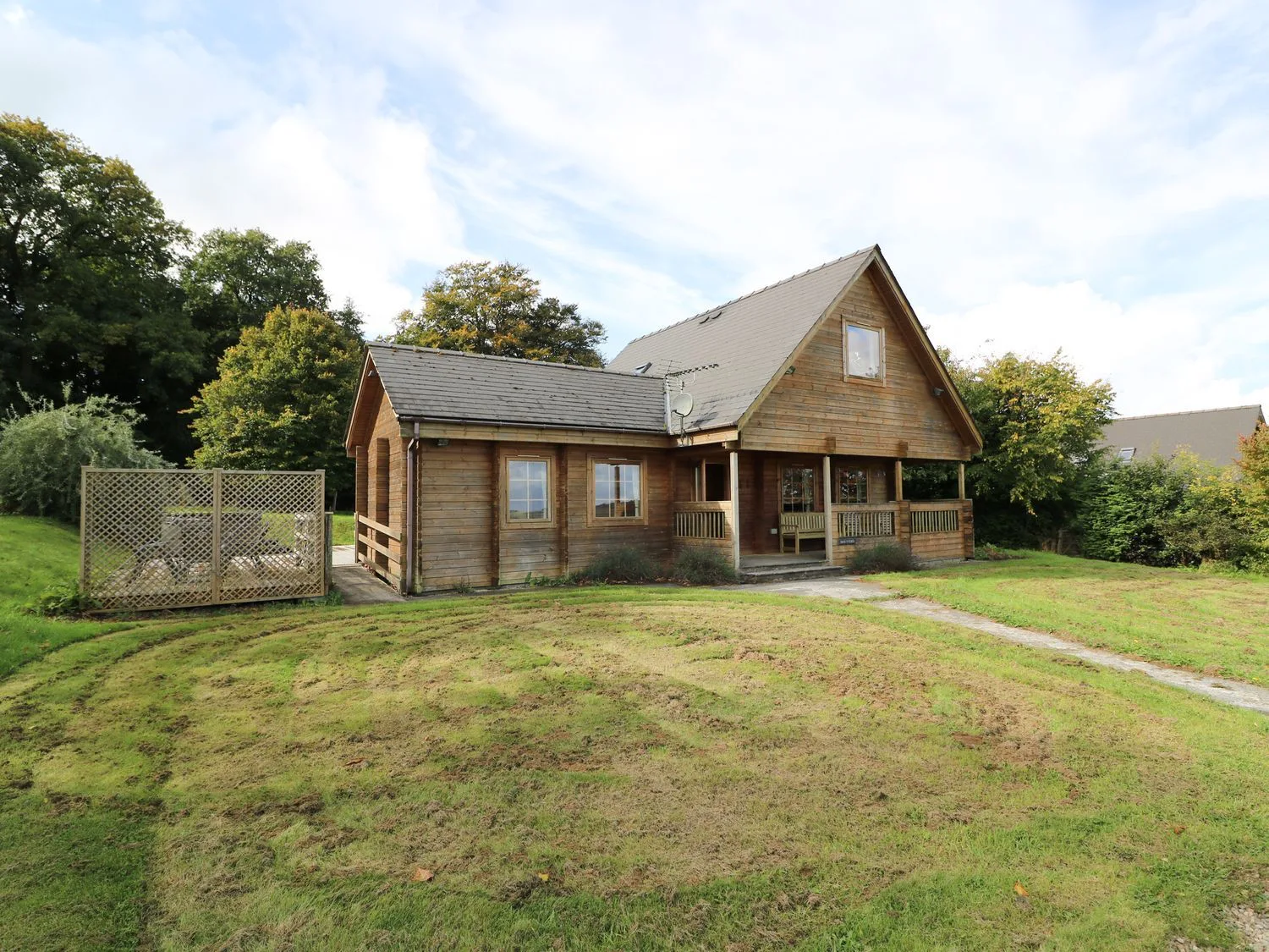 Dan Y Coed lodge with its enclosed garden and dog paddock